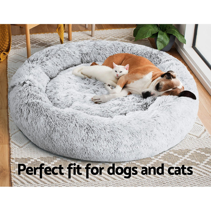 A large grey cushioned pet bed for both cats and dogs 