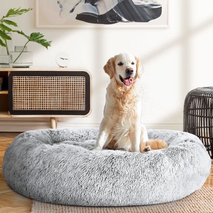 A large grey cushioned pet bed for both cats and dogs 